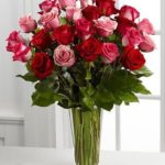 "A stunning bouquet of pink and red roses elegantly arranged in a clear glass vase, ideal for Valentine’s Day and available for same-day flower delivery downtown Chicago." Love and Romance Bouquet of Roses