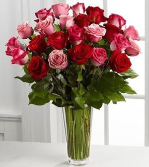 "A stunning bouquet of pink and red roses elegantly arranged in a clear glass vase, ideal for Valentine’s Day and available for same-day flower delivery downtown Chicago." Love and Romance Bouquet of Roses